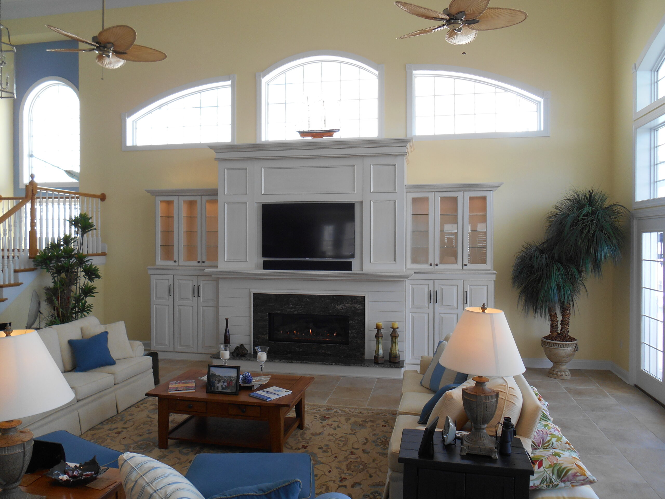 new fireplace construction after with white wood surround and mantel
