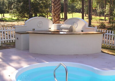 outdoor kitchen on back porch with built-in grill after