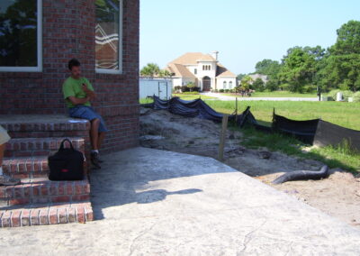 outdoor kitchen on back porch with built-in grill before