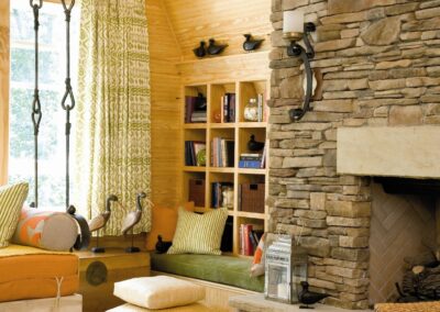 new gas fireplace in living room with stone surround
