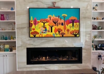 new gas fireplace in living room with marble surround