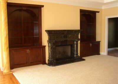 new gas fireplace in living room with wooden surround and mantel
