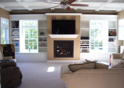 new gas fireplace in living room with wooden mantel