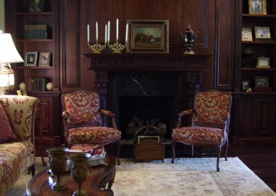 new gas fireplace in living room with wooden mantel