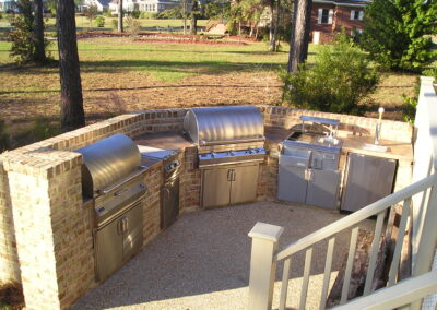 outdoor kitchen on back porch with built-in grill