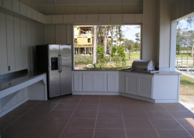 outdoor kitchen on back porch with built-in grill