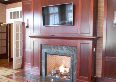 custom gas fireplace with darkwood surround